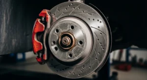 Brake dust accumulation on rotor and caliper leading to squeaky brakes