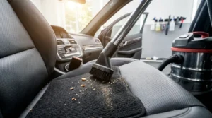 vacuuming car seats and carpets for interior cleaning