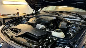 clean shiny car engine bay after safe cleaning