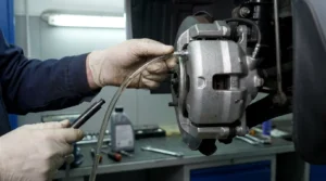 connecting brake bleeder kit hose to brake caliper valve