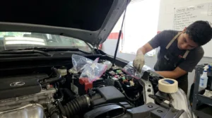 covering sensitive electrical components before cleaning engine bay