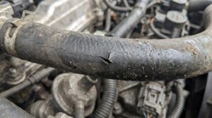 cracked vacuum hose causing engine vacuum leak symptoms