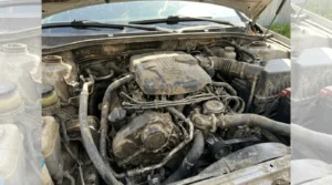 dirty dusty car engine bay before cleaning process