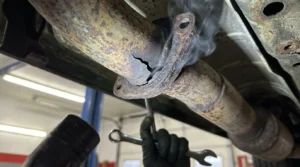 exhaust leak causing loud backfire noise in car