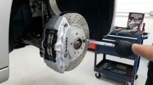 checking brake pad thickness for wear inspection