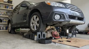 safe car maintenance while vehicle is on ramps